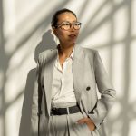 Contemporary Asian businesswoman in elegant grey suit
