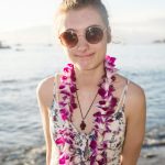 Pretty teenage girl with a Hawaiian lei on a beach vacation